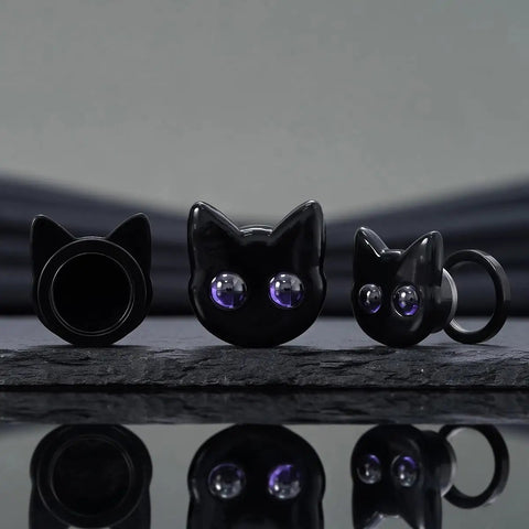 Black Cat Ear Gauges 5/8 Inch Stainless Steel Ear Tunnels with dope cartoon cat design and purple eyes on display