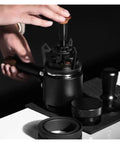 Smooth Operator Espresso Rotary WDT Tool And Coffee Stirrer With Built In Dosing Funnel Stand For Even Powder Distribution and Knockout Barista Shots At 54mm with hands adjusting tool.
