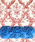 The OG Decorative Texture Paint Roller With Interchangeable Pattern Design Imprint Brush in blue, used for creating textured wall patterns.