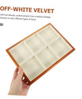 Premium Solid Wood Desktop Jewelry Organizer Tray With Divided Grid Compartments For Rings Necklaces Earrings And Watches Durable Storage Holder, off-white velvet compartments, held in hand.