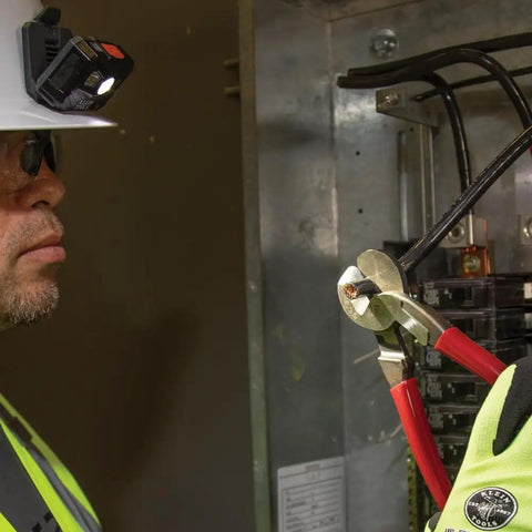 Electrician using Beefy 9-Inch High Leverage Cable Cutter For Aluminum Copper And 100-Pair Communications Cable Made In USA.