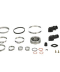 Stern Drive Transom Seal Repair Kit To Fix Your MerCruiser Bravo And Blackhawk Stern Drives With Exhaust Bellows Hoses Seals Gaskets And Clamps For Sealing The Transom Opening Right. kit parts laid out