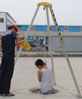 Emergency Tripod Rescue Kit With Self Locking Winch Hoist For Fall Protection And Industrial Height Work Safety Gear, in action with a worker and rescue subject.