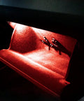 Kickin Red LED Glove Box And Footwell Lights For Volkswagen Vehicles Including Jetta GTI Atlas CC Eos Golf Alltrack Tiguan Touareg 3W 18 SMD Direct Fit Replacement For OEM Incandescent Lamps Super Bright Interior Accent emitting a bright red glow in a vehicle's glove box.
