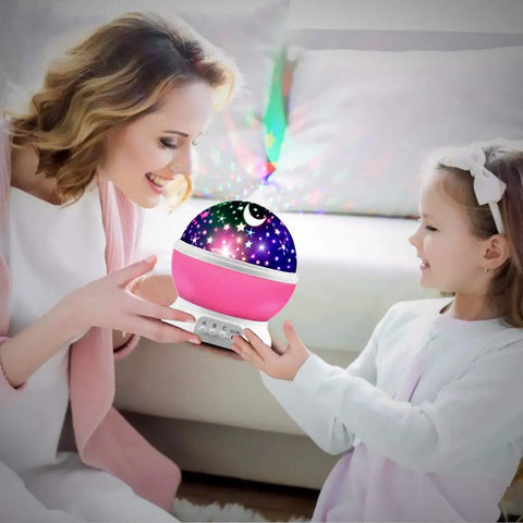 Star Projector Night Light For Kids Pink Bedroom Decor with rotating starry sky held by mother and daughter