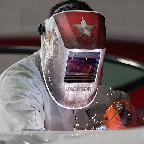 Welder using an Ultra Lightweight Auto Darkening Welding Hood With Premium Graphic Design Weighing 1.24 Lbs And Ergonomically Balanced