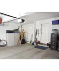 Garage with Multi Purpose Rubber Floor Mat For Indoor And Outdoor Use Built Tough To Protect Floors, black 30 by 48, installed near door.