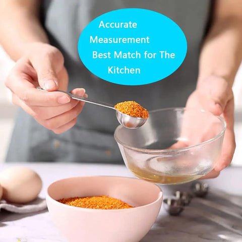 Person using 7 piece stainless steel spoon from 20 Piece Measuring Cups And Spoons Set For Cooking And Baking Gadgets in kitchen