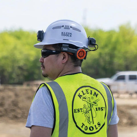 Worker wearing a hard hat equipped with Dual Cooling Fan For Hard Hats And Safety Helmets, Lightweight USB C Rechargeable Head Neck And Face Cooler.