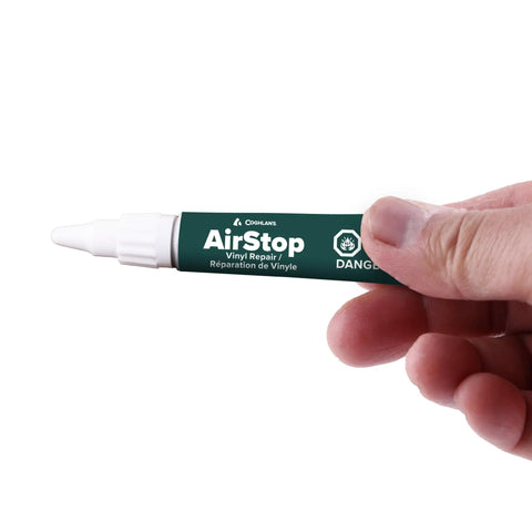 Hand holding a 0.27 oz tube of Airstop Vinyl Repair Sealant For PVC And Inflatable Repairs Waterproof Flexible Patch Up.