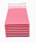 Stack of Pink Poly Bubble Mailers 3.5 By 5 Inch Small Padded Envelopes Self Sealing Shipping Bags 50 Pack for protective packaging.