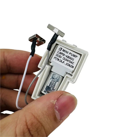Top Shelf Replacement Pump Motor For Vacuum Water Tank, compact mini pump in hand with wires for easy install.