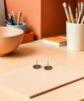 Top Tier Round Cap Roofing Nails With Insulation Washers Brown House Wrap Fasteners For Felt Foam Board And Weather Guard Sheathing 200 Piece Kit No Sweat Setup Grip Tight Fit on a desk with a soft background.