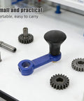 Close-up of blue manual hand crank with ergonomic grip, surrounded by gears, part of Heavy Duty Rotary Tiller Handle Attachment Two Pack.
