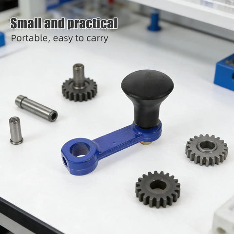 Close-up of blue manual hand crank with ergonomic grip, surrounded by gears, part of Heavy Duty Rotary Tiller Handle Attachment Two Pack.