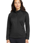 Torque II Women's Lightweight Water Resistant Full Zip Athletic Jacket shown in black, tailored fit, for gym and everyday wear.