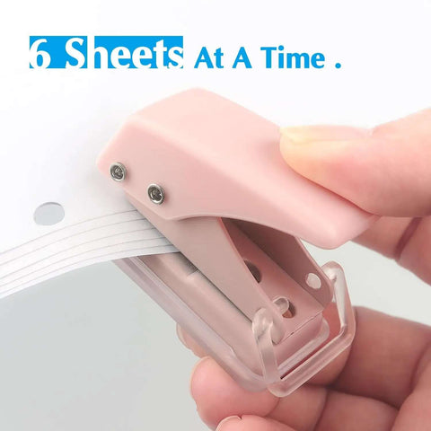 Close-up of Three Piece Mini Hole Puncher Set with Six Sheet Capacity each for ID cards and crafts, showing easy punching in use.