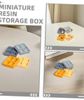 Four Grid Dollhouse Storage Box Resin Organizer For Candy, Nuts, And Sweet Tiny Treats in assorted colors on a table