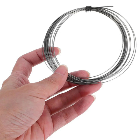 Universal Vacuum Sealer Heating Cable And Heat Shrink Strip Replacement For Industrial Machines Dead Nuts Compatible Plug And Play Setup Built Tight To Maintain Consistent Sealing Performance Every Single Time - close-up of hand holding wire