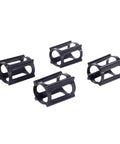 Set of four black Skateboard Trick Training Wheels To Nail Ollies And Kickflips Faster, a no fall practice tool that locks the wheels.