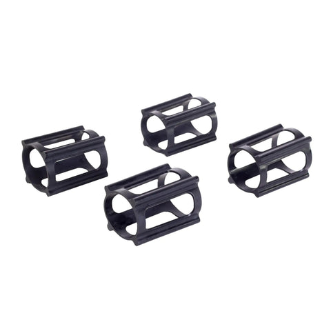 Set of four black Skateboard Trick Training Wheels To Nail Ollies And Kickflips Faster, a no fall practice tool that locks the wheels.