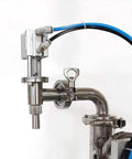 Detail of Top Tier Automatic Bottle Filler With Fully Pneumatic Piston Drive, Drip Proof Single Head Nozzle, focusing on stainless steel nozzle.