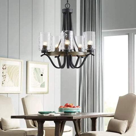 Black farmhouse chandelier with ripple glass shades above dining table in bright room, featuring Three Light Modern Farmhouse Chandelier With White Fabric Shade For Dining Room Living Room Foyer Hallway Ceiling Light, Adjustable Rods, Easy Install, Rustic Chic Vibe For Your Home.