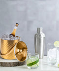 Gold Double Wall Insulated Ice Bucket With Lid And Scoop Keeps Drinks Frosty All Night Long Backyard Bash Essential Heavy Duty Stainless Steel Design Squad Approved with ice and drinks.