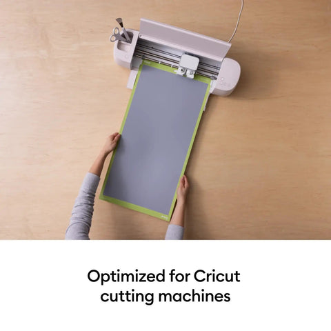 Person positioning a cutting mat onto a Cricut machine. Cutting Mat Variety Pack Four 12 By 24 Inch Mats For Crafting Workhorse Set.