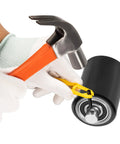 Hands using tools to install bearings on Front Load Pallet Jack Wheels Replacement Kit for PTH50, Pair Front Load Rollers.