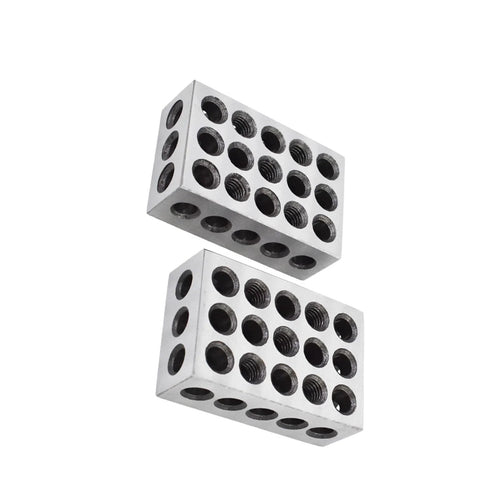 Angled view of two silver steel 1-2-3 blocks with 23 holes, precision machinist milling jigs