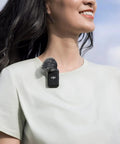 Person wearing wireless lavalier microphone system with two transmitters and one receiver for interviews YouTube vlogs live streams