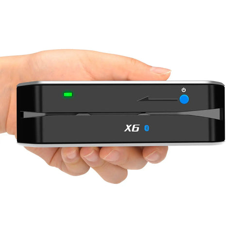 Bluetooth Card Reader and Writer Pro With USB 3 Multi Track Swipe Encoder held in hand showing buttons and LED light