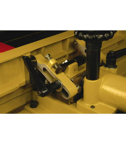 Close-up of Workhorse 16 Inch Parallelogram Jointer With Helical Head showing precision adjustment mechanisms and cast iron components.