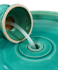 Close-up of 22 Inch Ceramic Bird Bath Fountain With Lotus Design, showing the spout and glazed ceramic in Aqua Green.