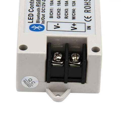Bluetooth LED Strip Light Controller For iOS And Android showing terminal connectors with QC Passed label