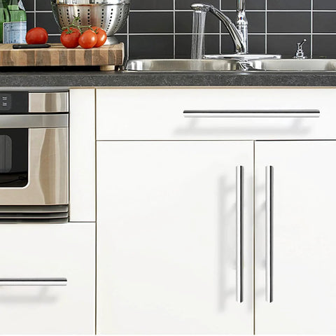 Kitchen with polished chrome T bar cabinet pulls 256mm hole centers installed on white cabinets