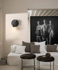Living room with French Bulldog Wall Sconce Light With Resin Bulldog Bust, E26 Gothic Style Lamp above a white sofa.