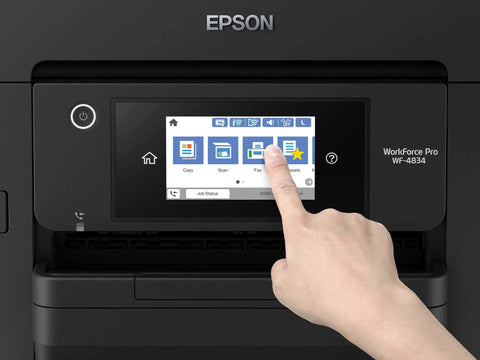 Hand pointing at touchscreen of Wireless Color All In One Inkjet Printer With PrecisionCore Heat Free Tech And Instant Dry Pigment Ink.