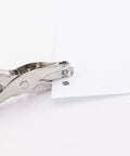 Tiny One Eighth Inch Circle Hole Paper Punch cutting paper with 1/8 inch hole, compact handheld metal puncher, anti rust construction, grippy handle.