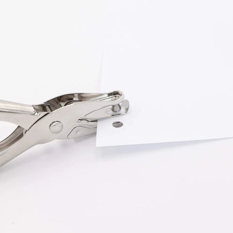 Tiny One Eighth Inch Circle Hole Paper Punch cutting paper with 1/8 inch hole, compact handheld metal puncher, anti rust construction, grippy handle.