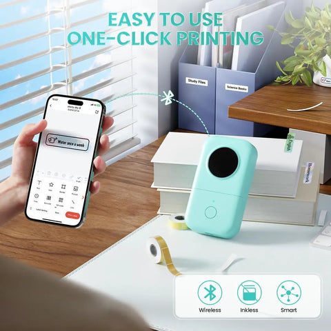 Portable Bluetooth Label Maker D30 With Three Tapes White Gold Clear, Handy Thermal Printer For Home Use next to smartphone.