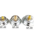 Back view of three brass industrial pressure gauges GF-40, GF-50, GF-60 showcasing thread fittings for equipment monitoring.