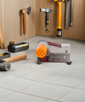 MAGICLULU High Torque Electric Mini Belt Sander With Efficient Heat Dissipation compact grinding machine on workspace floor.