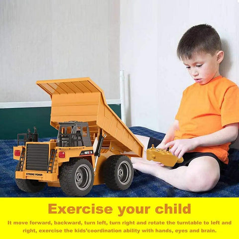 Child playing with Rad Remote Control Dump Truck Toy 2.4G RC 6 Channel Bulldozer, demonstrating hands-on construction play.