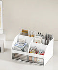 Ultimate Desk Organizer With Six Compartments And Two Drawers, Plastic Makeup Organizer And Pen Holder on a white desktop