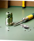 Beefy Heavy Duty Stainless Steel Pulley Block Set For Boats Kayaks And Yachts with screws and screwdriver on green table