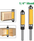 Four Piece Flush Trim Router Bit Set With One Quarter Inch Shank and Dual Bearings, showcasing carbide blades and cutting edges.