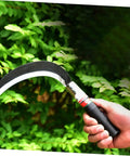 Hand holding one of the Two Pack Manganese Steel Portable Weeding Tools For Grass Removal And Harvesting With Short Handle Design