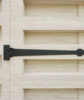 Wrought Iron Heart Style Strap Hinge on wooden cabinet door, 18 inch, heavy-duty, black powder-coated finish, with hardware for cabinets.